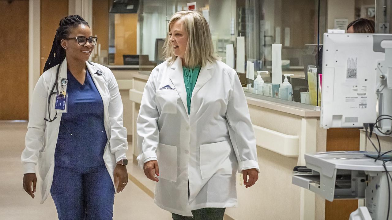 Dr. Billie Madler at hospital with University of Mary graduate nursing student.